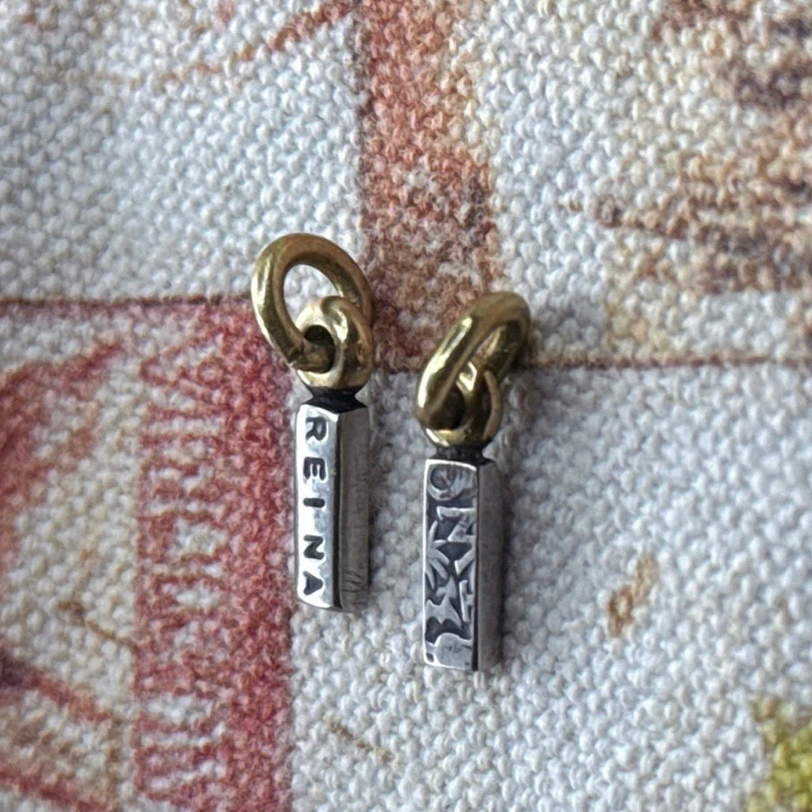 Reina tag Charm